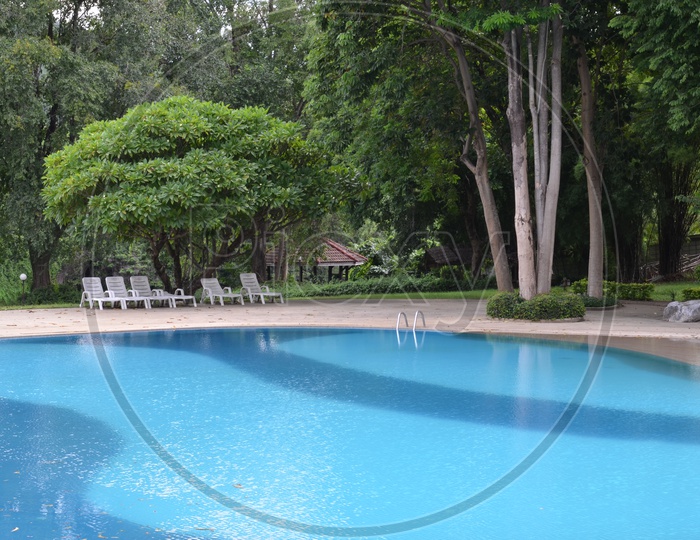 Swimming Pool With resting Chairs