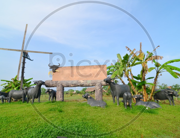 Lawn in a botanical garden at Khao Yai National Park  With Buffaloes and Deer Statues