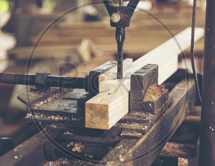 Machine Cutting Of a Wood Log In a Workshop Closeup