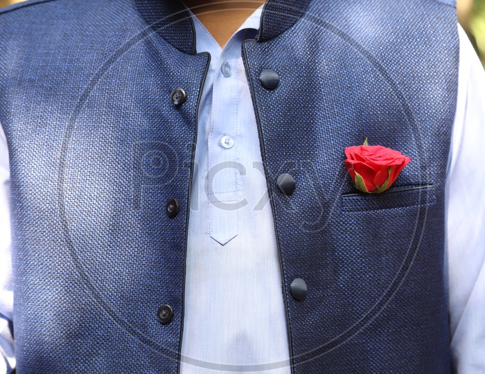 A Man wearing Rose in the Pocket Square
