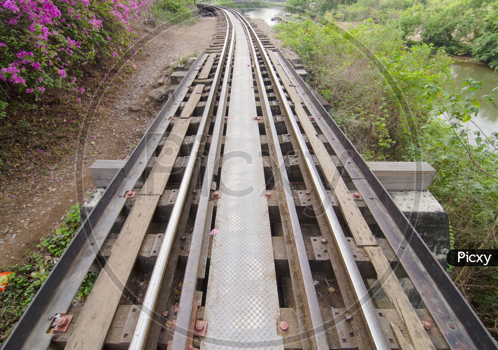 Railway Track Built During World War II In Thailand Over River Kwai Closeup View