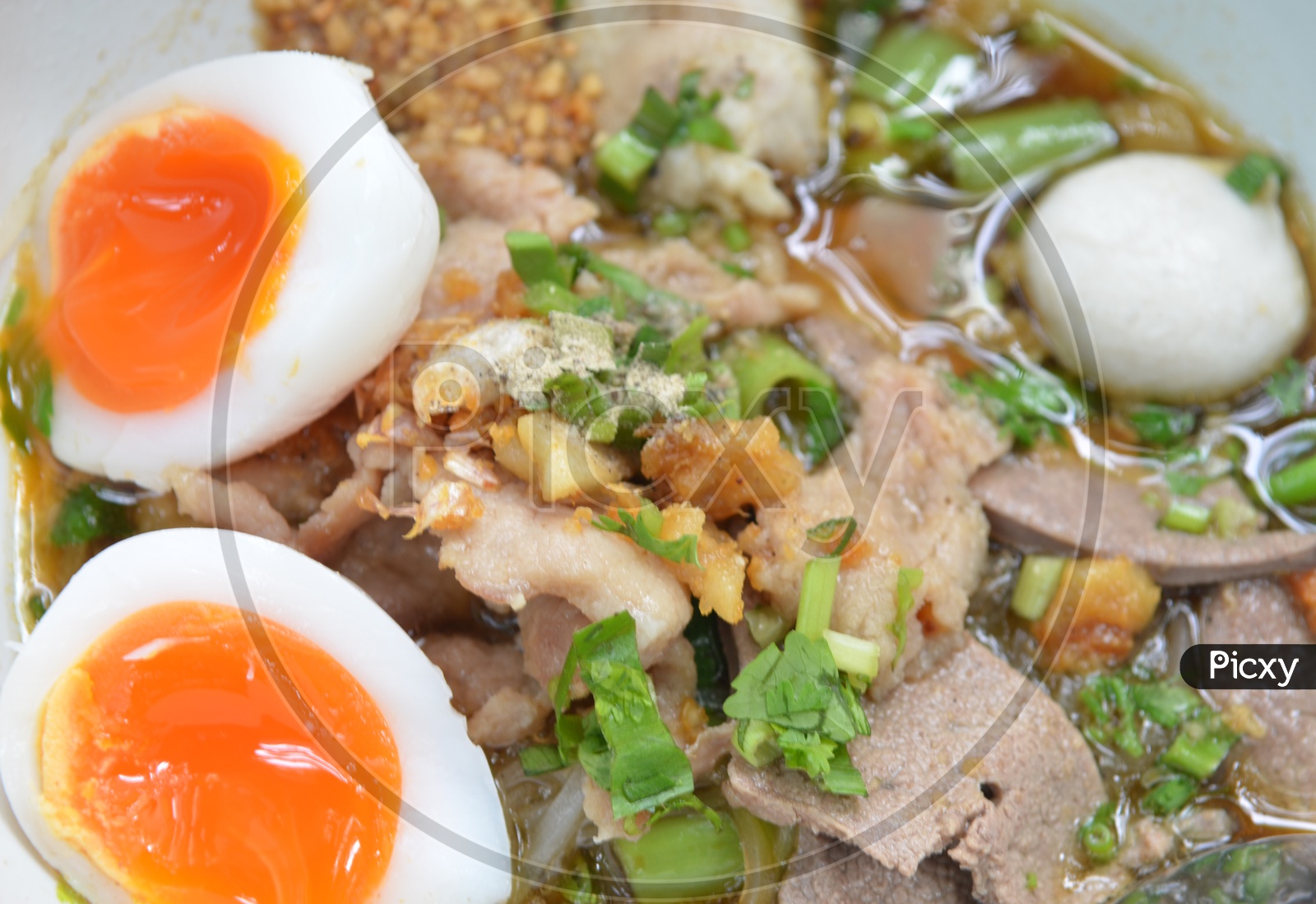 Bowl With Thai pork Noodles and  Boiled egg  Closeup
