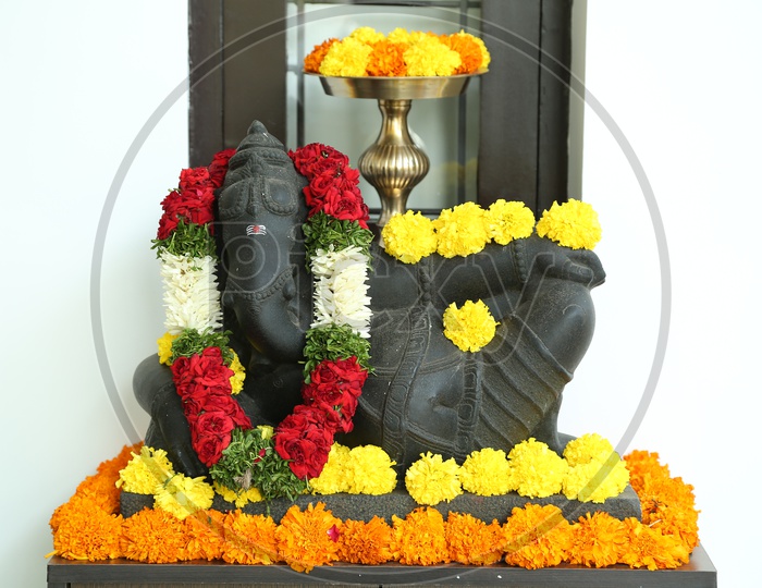 Lord Ganesha Statue decorated with Garlands