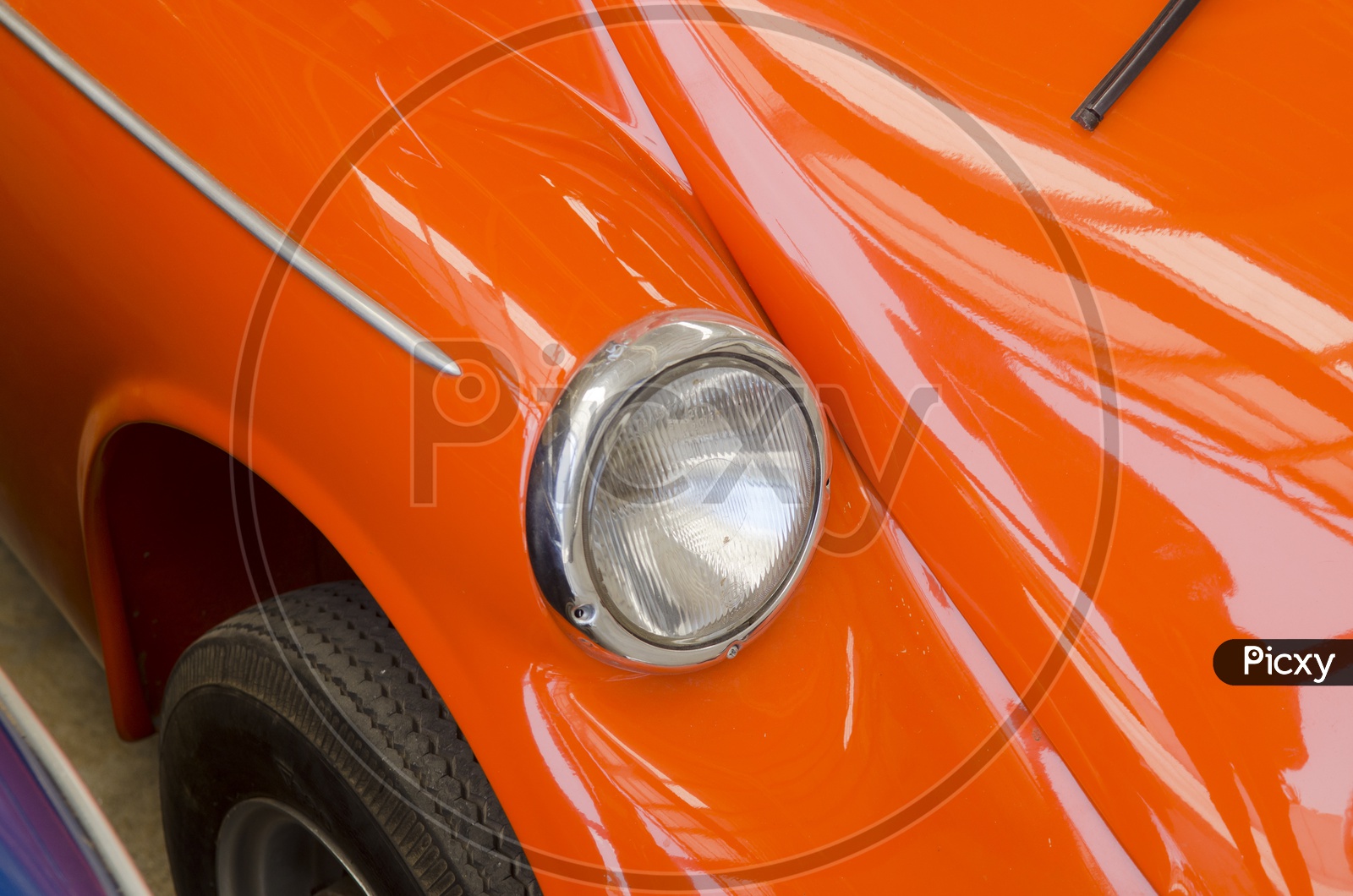 Head Light Of a Orange  Vintage Car