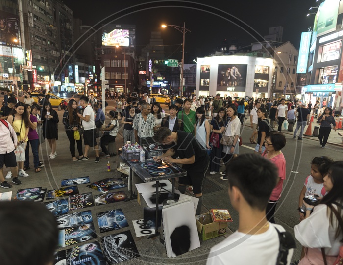 Locals and tourists enjoying the street market of Taipei downtown in Taiwan, Asia