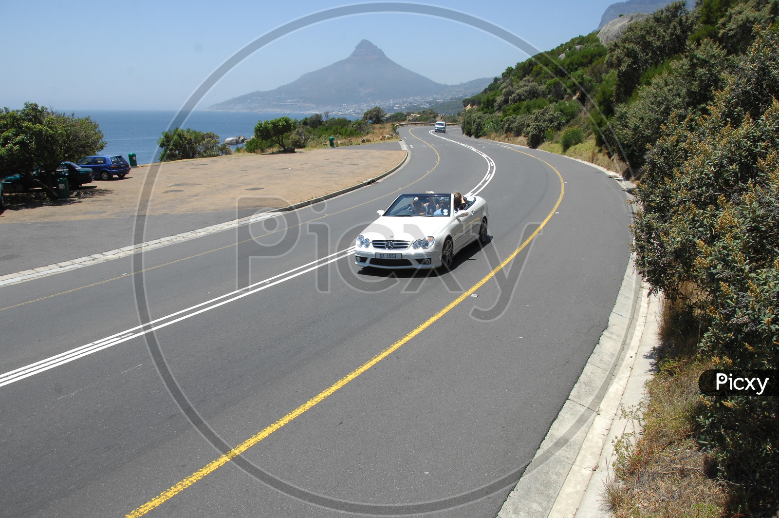 Mercedez Benz Car moving along the curvy road