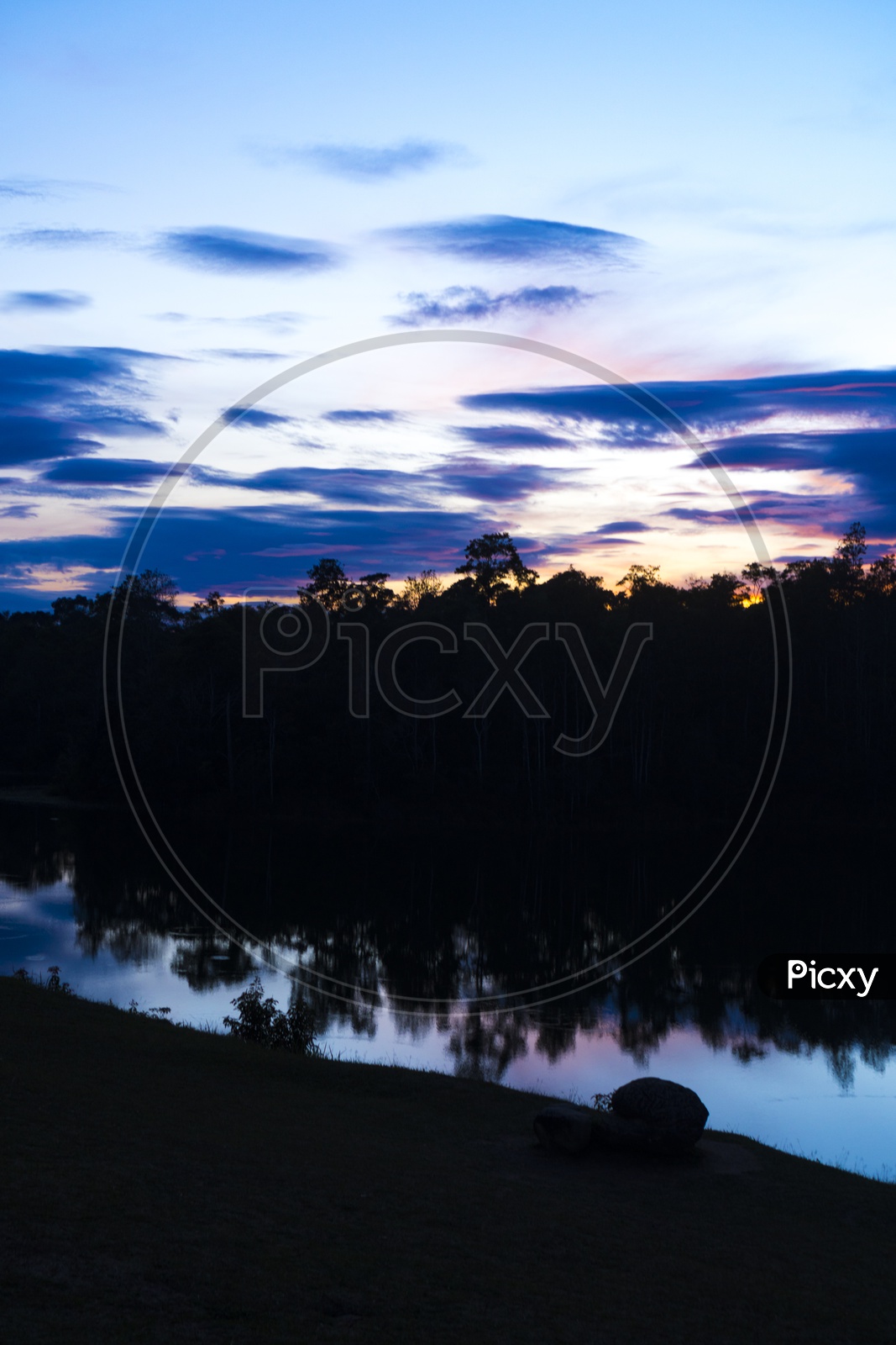 Sunset Over Tropical Lake With Bluehour Sky In  Background