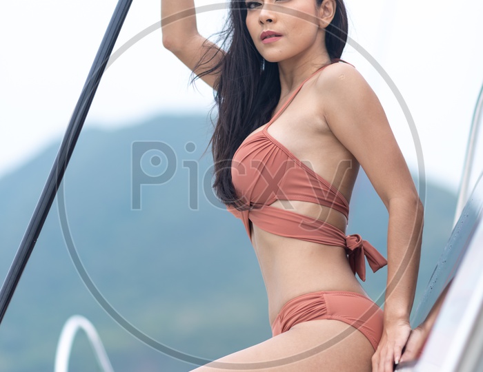 Young girl in bikini on a Yacht