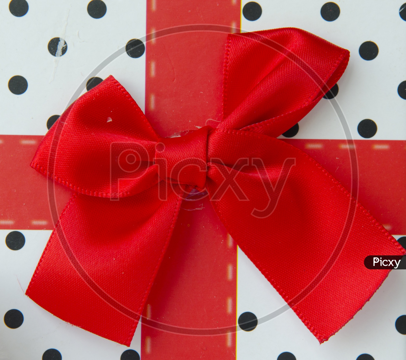 Gift box With red Ribbon a Present for Christmas Closeup