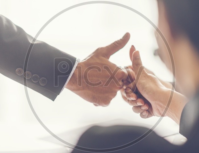 Startup Business Entrepreneurs Joining Hands With Thump Up gesture  In a Business Meeting Hands Closeup