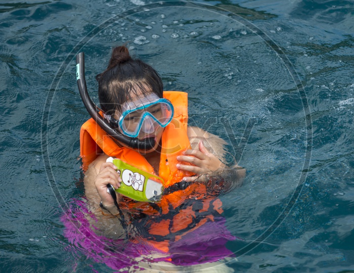 Young Woman Doing Deep Diving In Sea At Phuket
