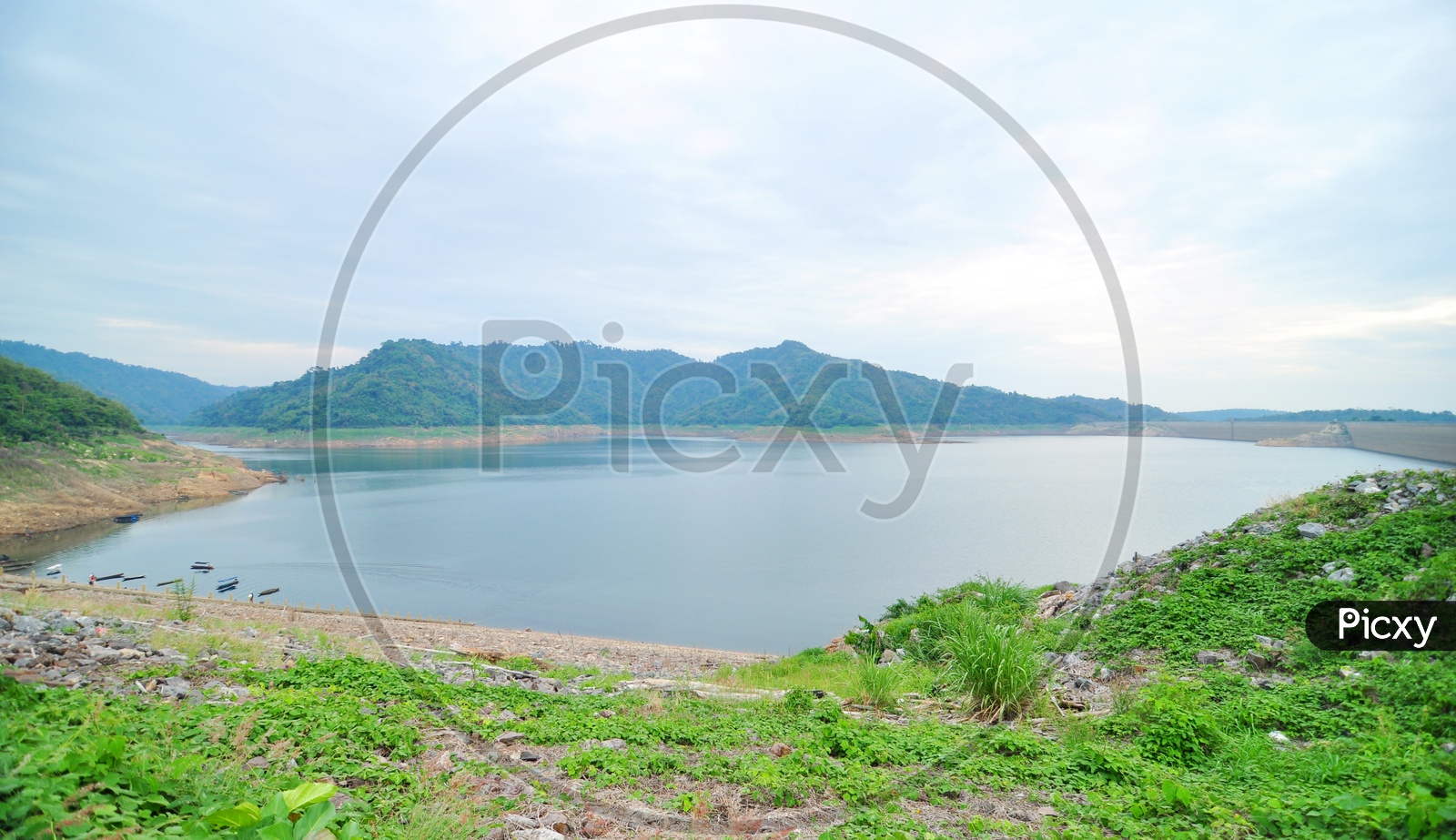 Lake with Mountains in Background in Thailand