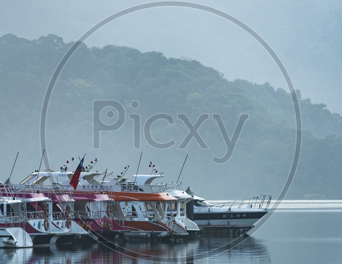 Tourist boats Or Yacht Boats  docking in peaceful morning at Shuishe Pier, Sun Moon Lake, Taiwan.