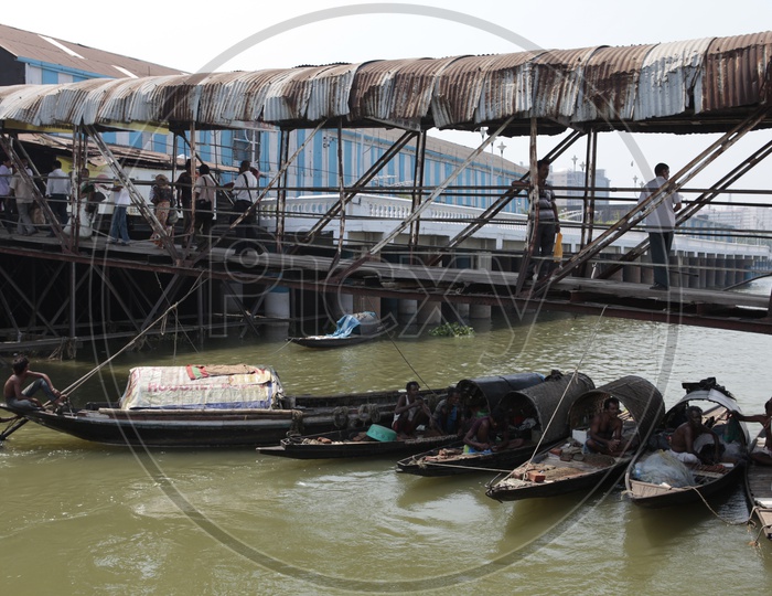 Indian Gondolas anchored alongside the river
