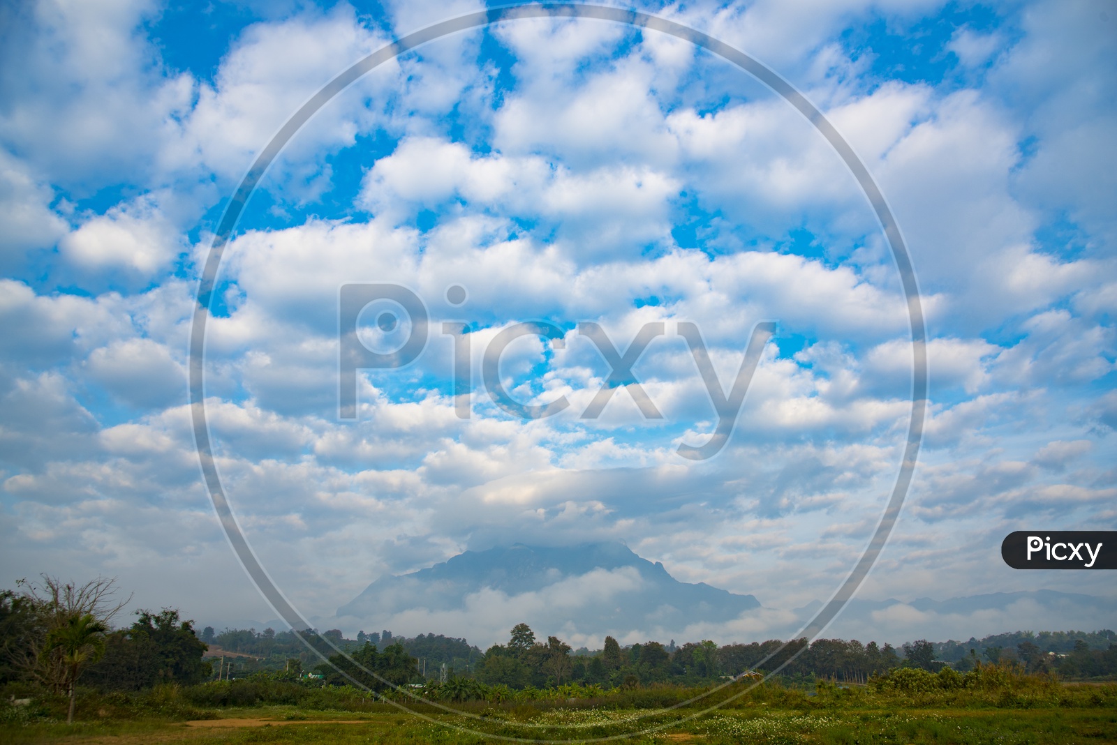 Clouds over the mountain and fields, natural location in Thailand