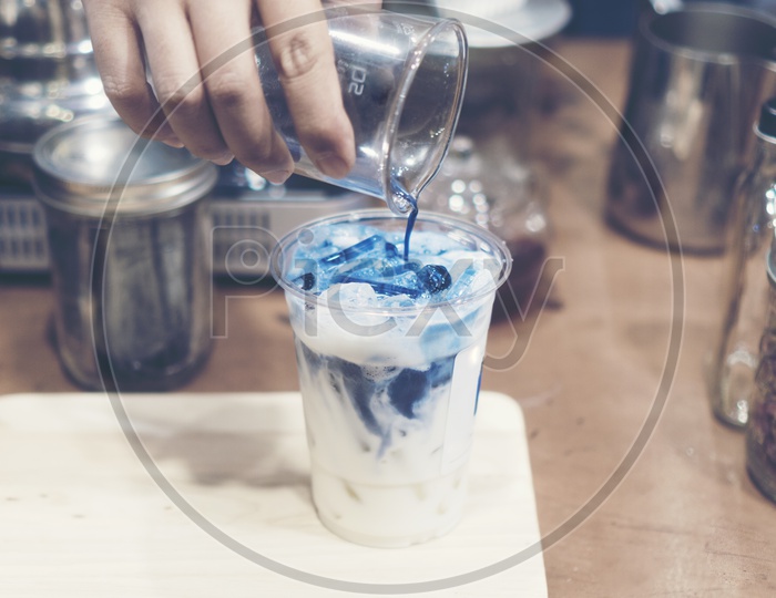 Blue latte art with milk and ice  by Chef