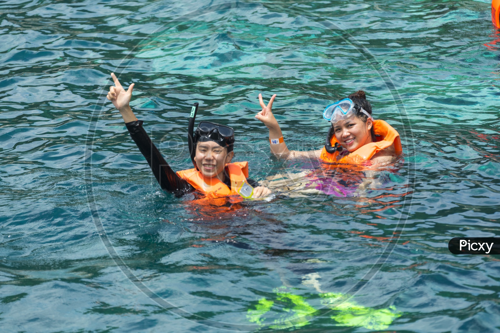 Tourists Woman Enjoying Deep Diving In Sea At Phuket