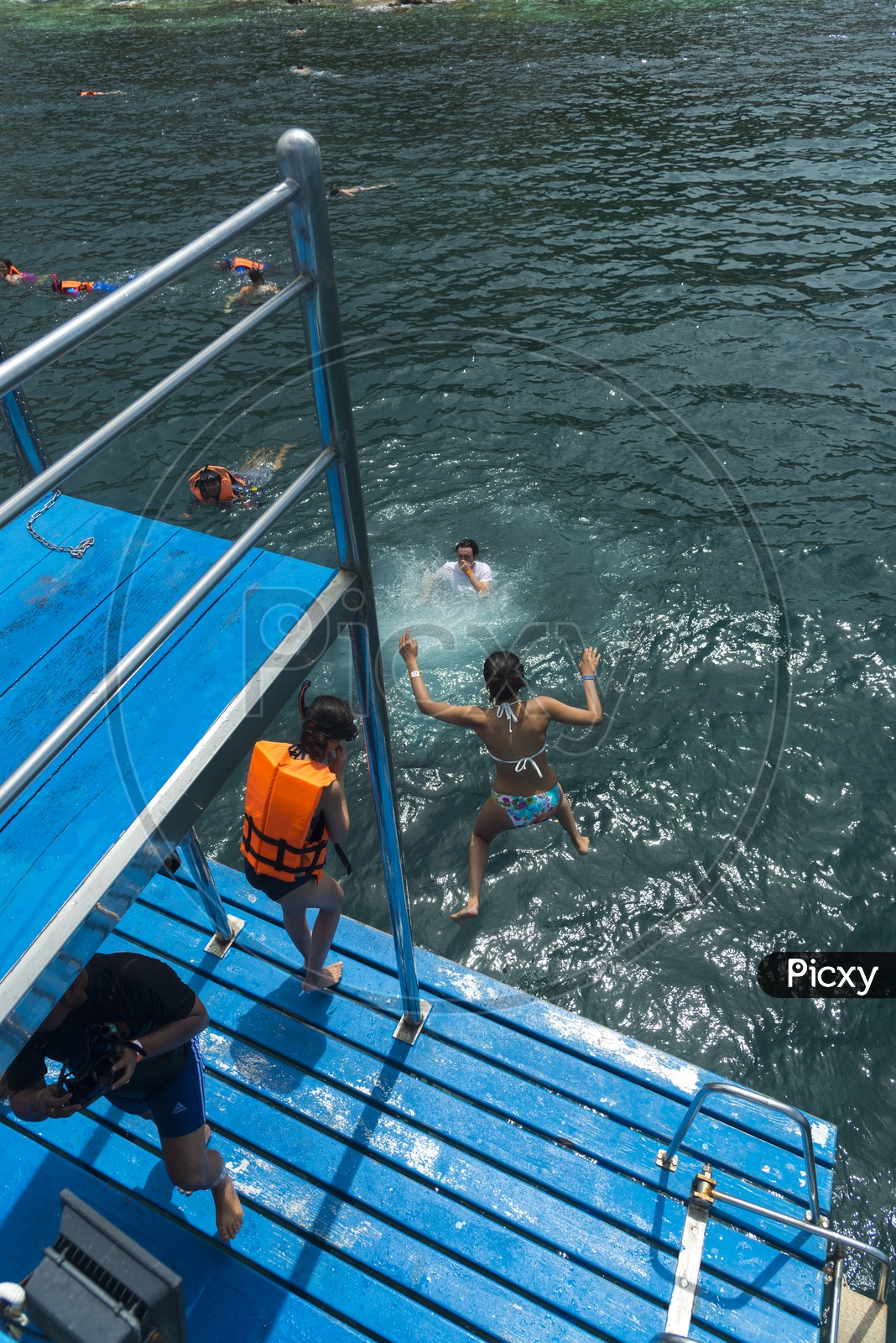 Tourists Jumping Into Sea From Boats For Swimming In Sea At Phuket