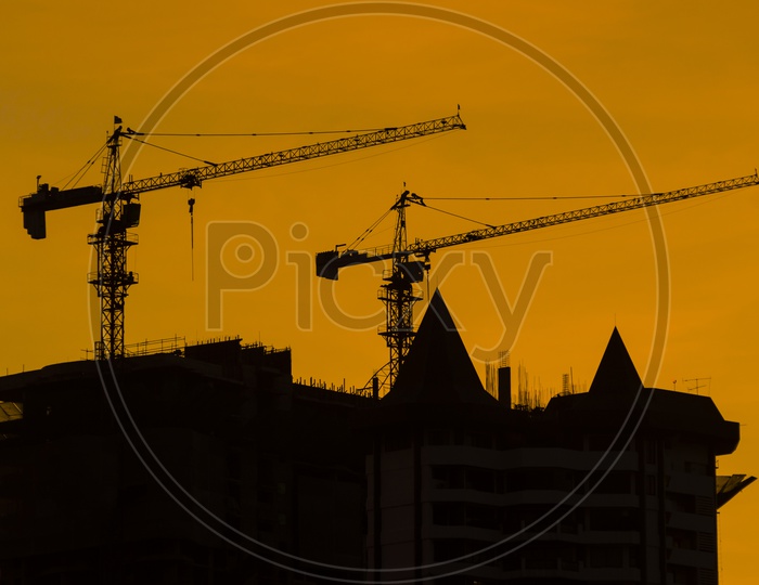 Sunset over the construction crane