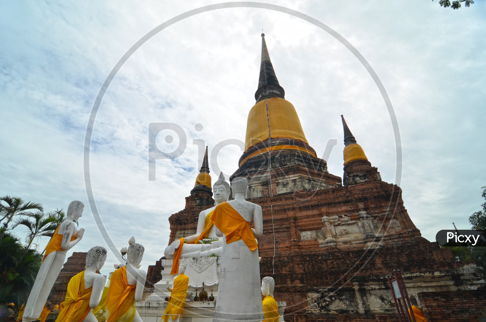 Temple Shrines Or Pagodas with Buddha statues at the temple of Wat Yai Chai Mongkol in Ayutthaya near Bangkok, Thailand