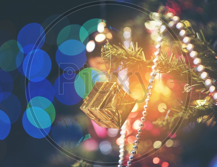 Decorated Christmas tree on blurred, sparkling and fairy Light Background