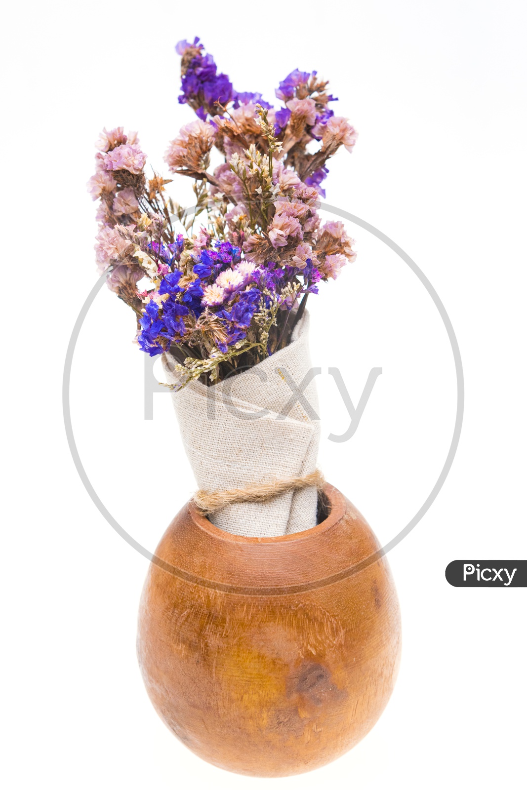 Beautiful vintage flower bouquet in a wooden vase isolated on white background