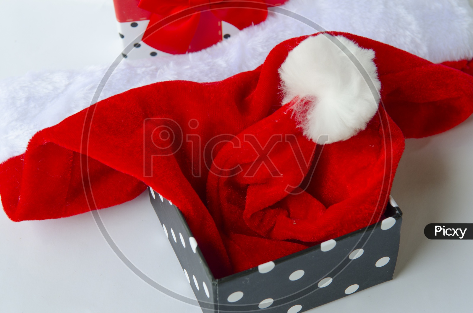 Present for Christmas With Santa Cap or hat in gift Box