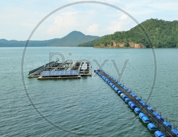 Solar panels and buoy Lines on the water Surface  at a Hydroelectric power generation Plant