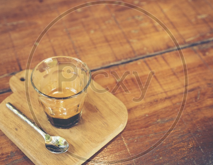 black coffee Drip In a Glass At a Cafe Table