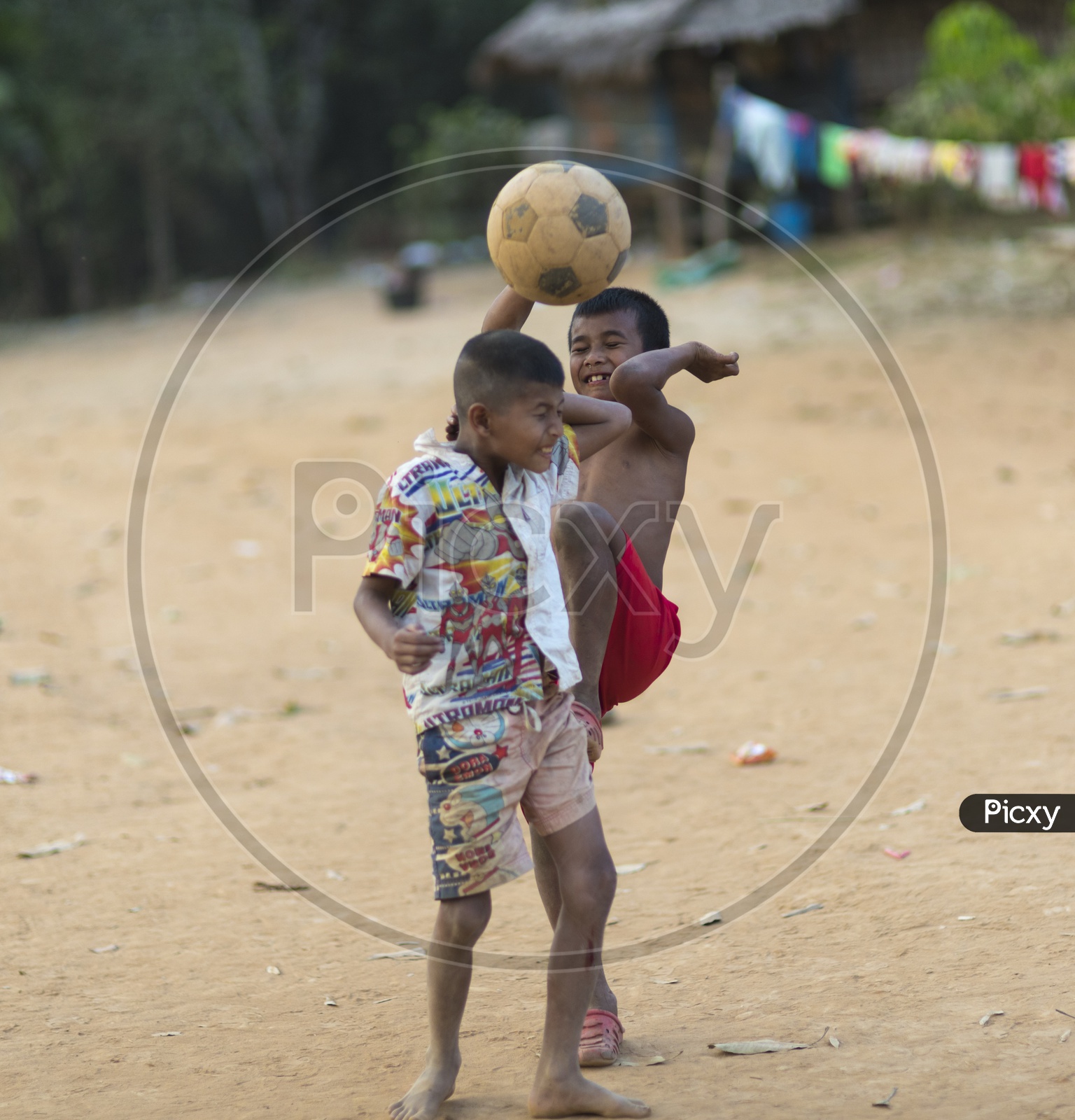 Children Having Fun While Playing Football