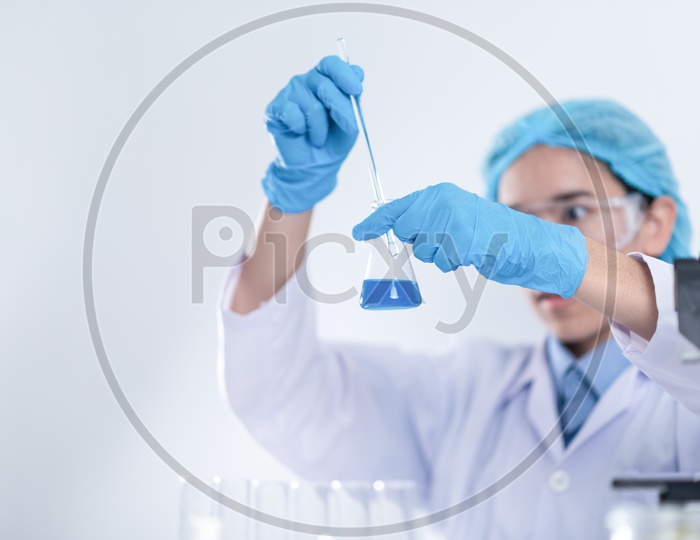 Researcher in the laboratory Studying  or Testing Chemical Mixtures