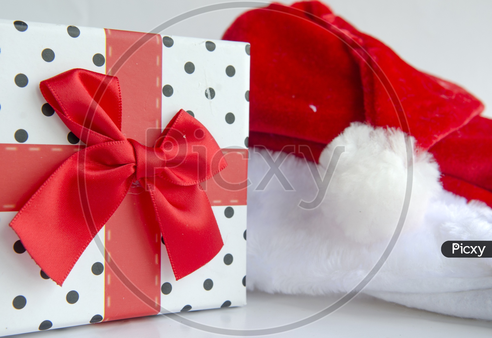 Santa Claus hat with Gift Box For Christmas On an Isolated White Background