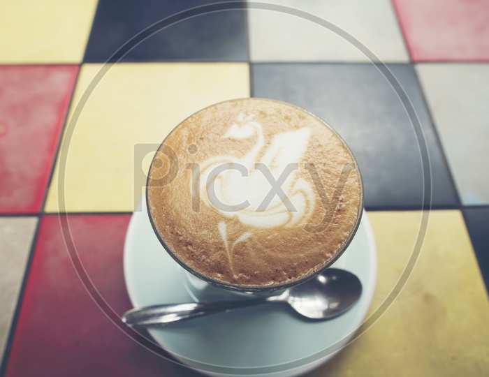 Latte Art On Coffee on Cafe Table