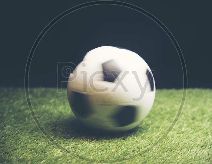 Spinning Soccer ball on grass