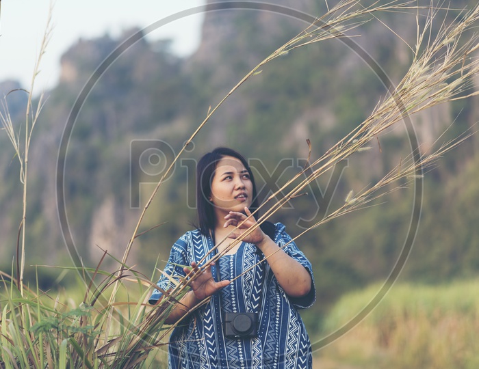 A Woman Photographer in Nature Background