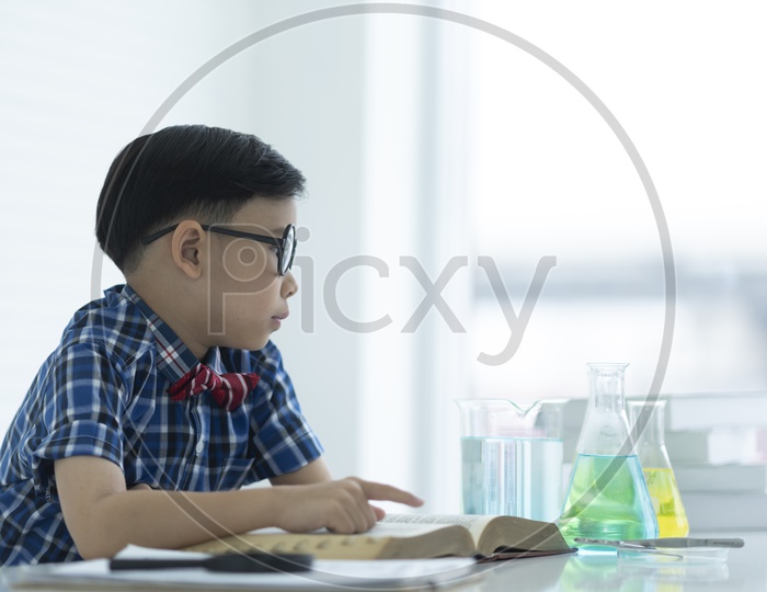 A school boy in the chemistry laboratory