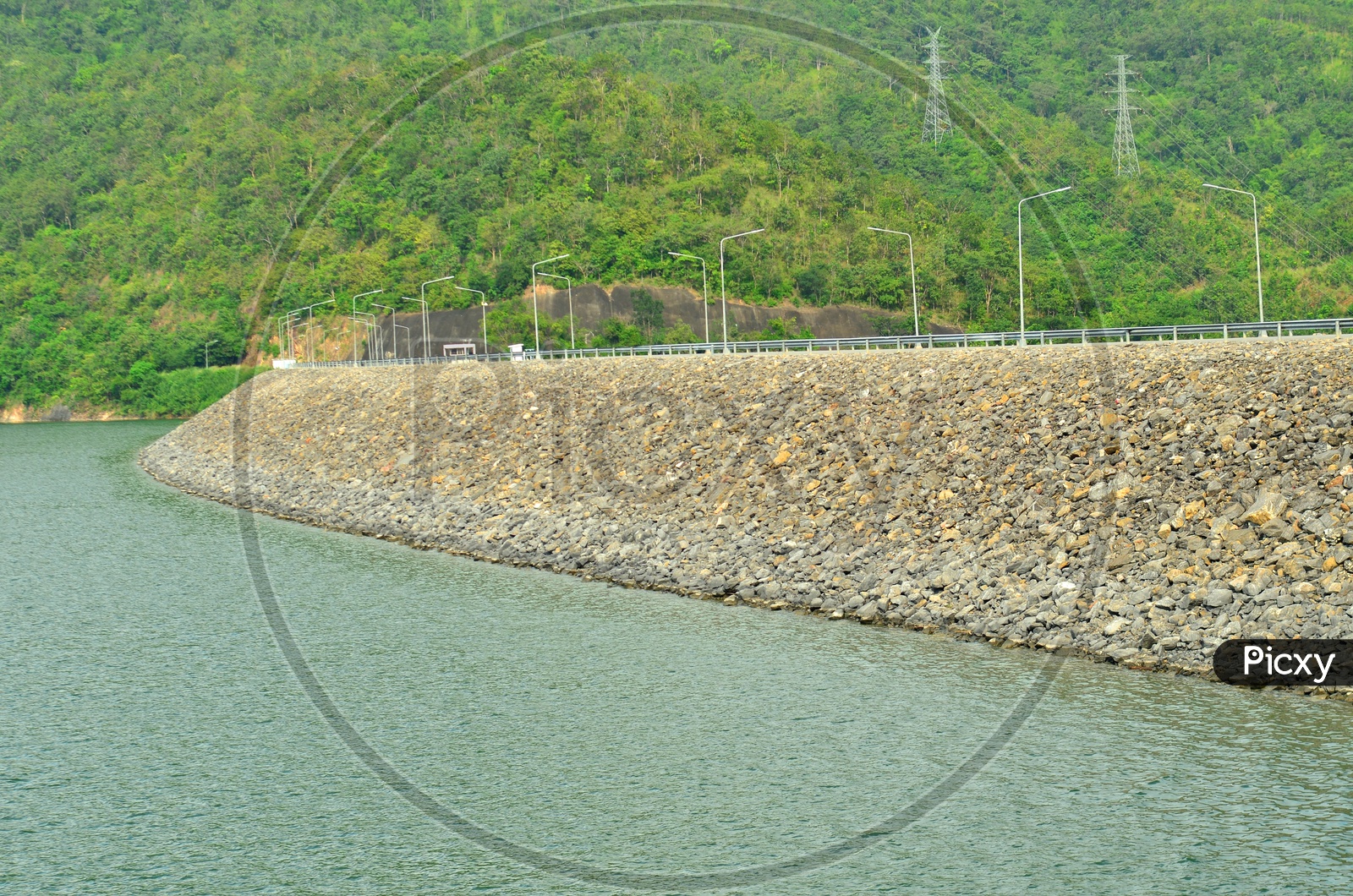 Water Storage in a Reservoir with electric hi tension poles in the background