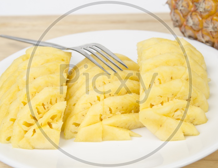 Pineapple Slices On Plate Closeup