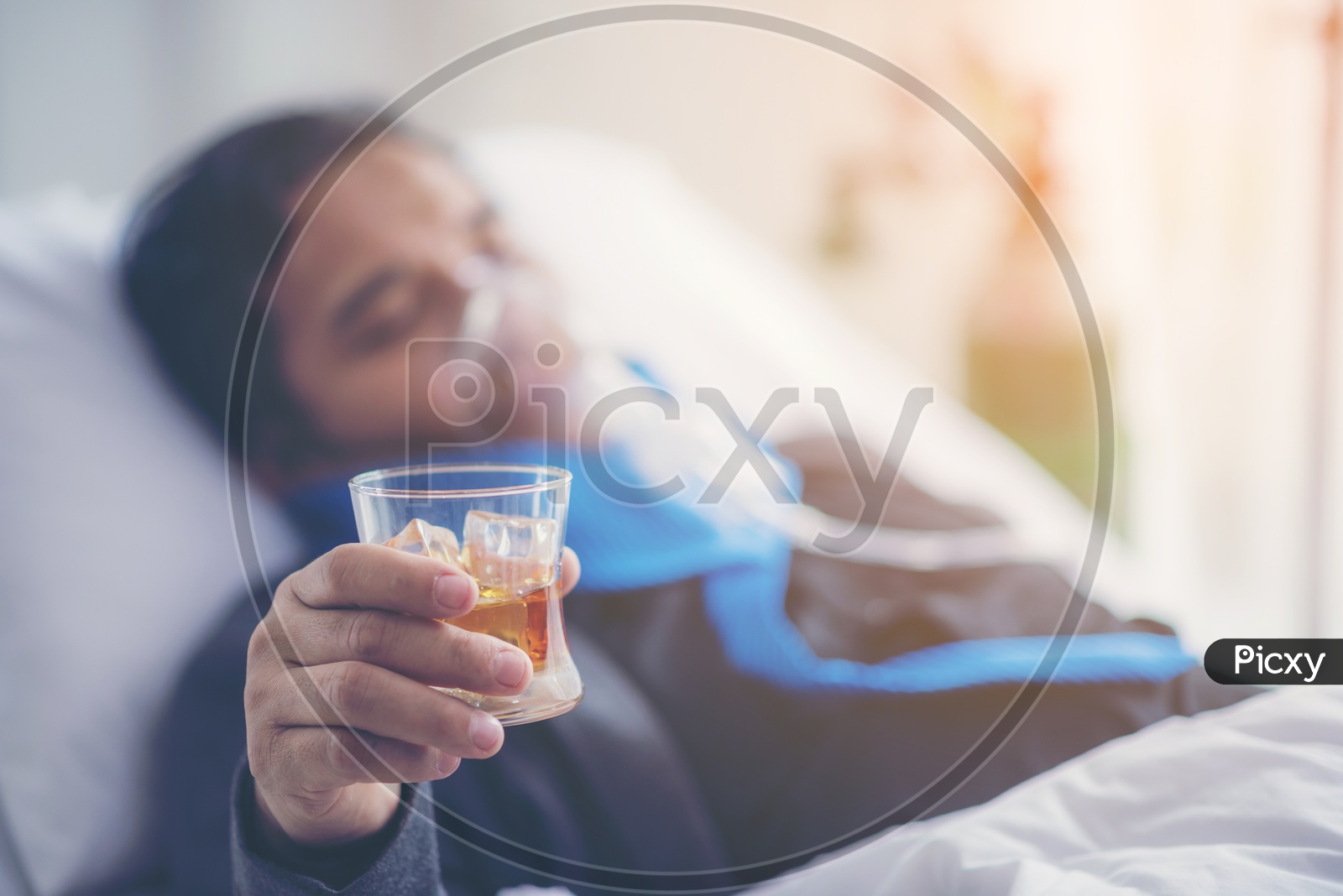 Alcohol addiction - drunk businessman holding a glass of whiskey