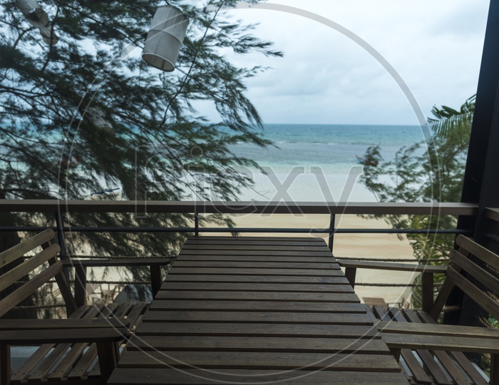 Wooden Table At a Beach View Restaurant