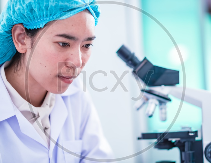 Asian scientist  researching in laboratory, chemical lab