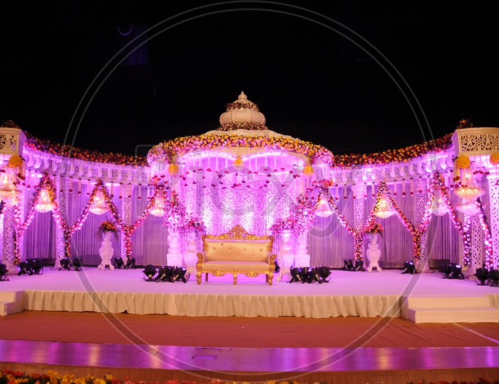 A Well Decorated Wedding Stage with lights
