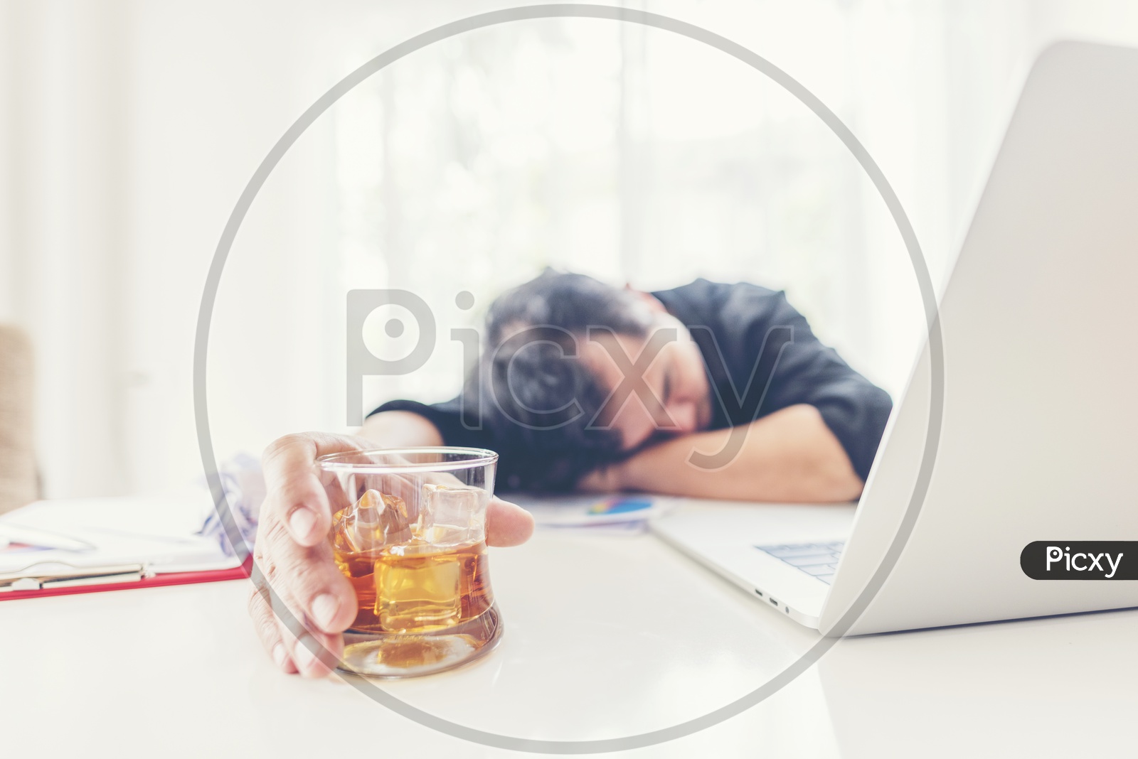 Depressed Or Stressed Business Man Addicted to Alcohol With Alcohol Glass At Office Desk