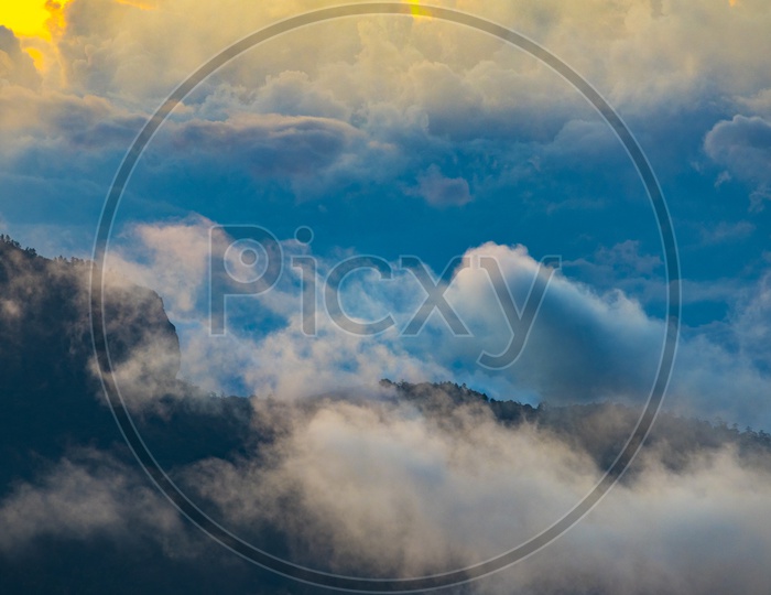 Mountains, clouds during sunset. Beautiful natural landscape in the summer time