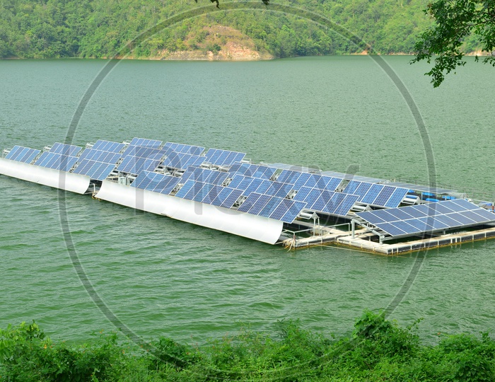Solar panels on the water Surface At a Reservoir Or Dam