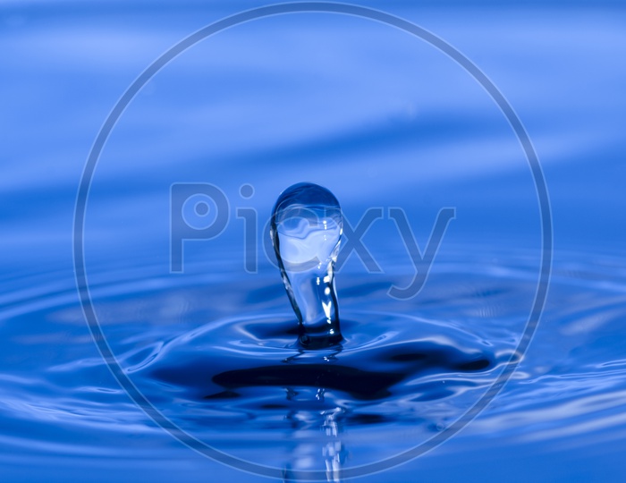 Closeup of blue water splash Of Droplet