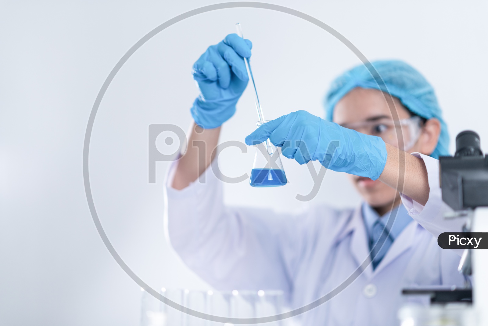 Researcher in the laboratory Studying  or Testing Chemical Mixtures