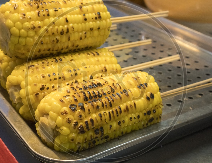 Sweet corn Grilled In a Street Food Vendor stall
