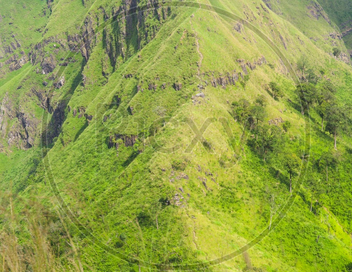 Green Mountain Cliff With pathways For Trekkers