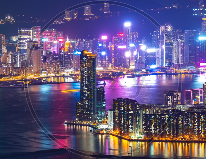 Night Scape of Hong Kong City With Building Lights and River Side